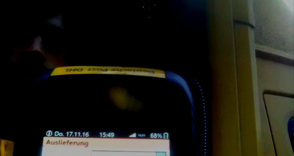Beweisphoto eines DHL Scanners mit Datum und Fahrer 